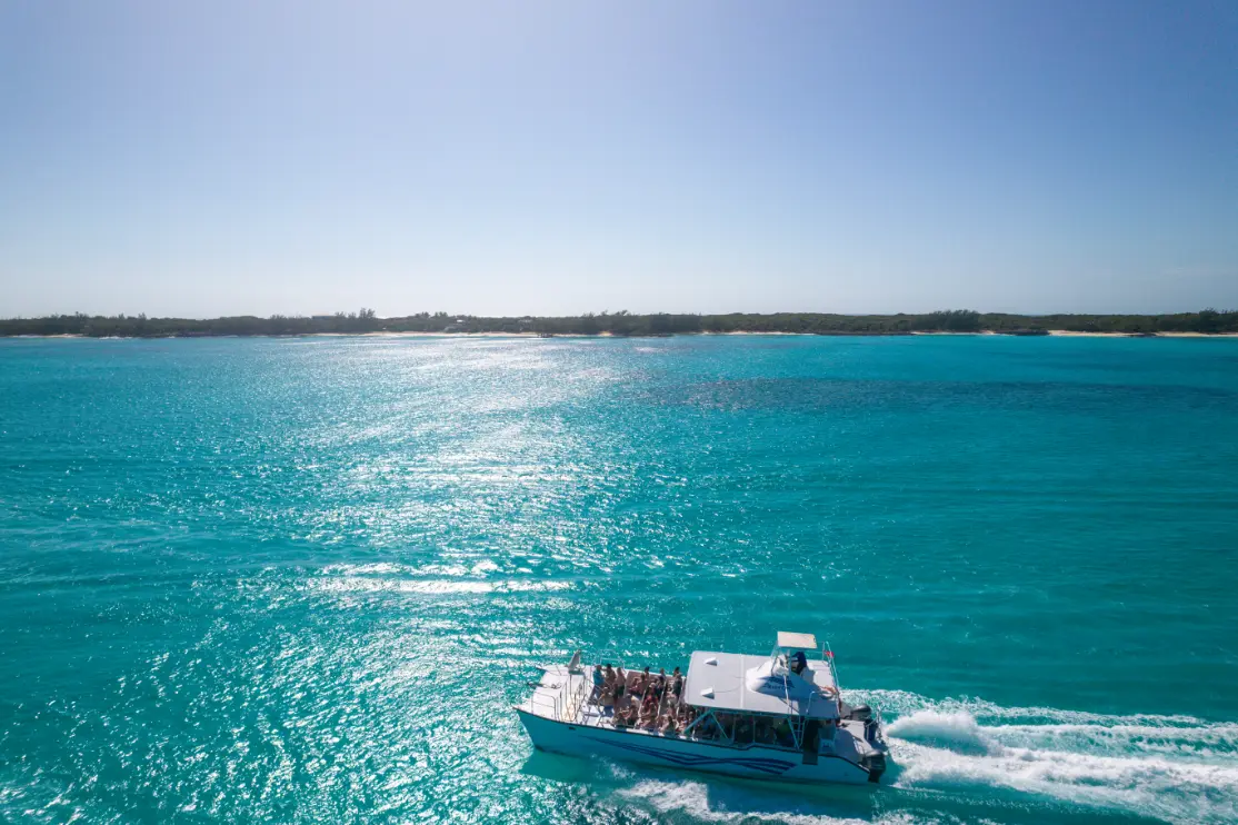 Seas N' Cays catamaran on the water at golden hour in the Bahamas