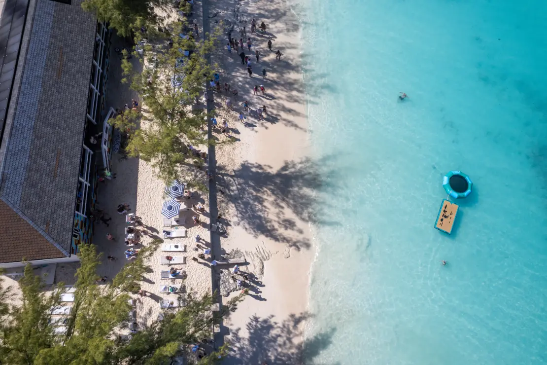 White sand beach and shallow turquoise water at Rose Island, Bahamas